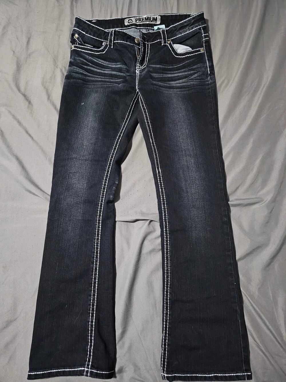 Black denim jeans contrast stitching five pocket zip fly